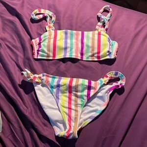 Two piece striped No Boundries bikini top is medium bottoms are large